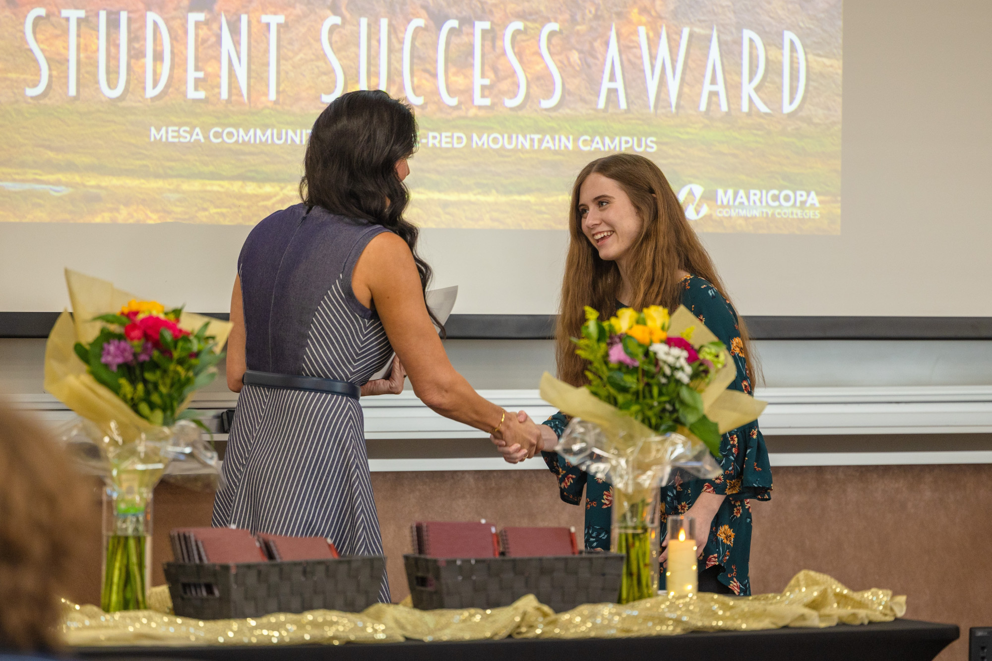 A student being presented with a Summit Award