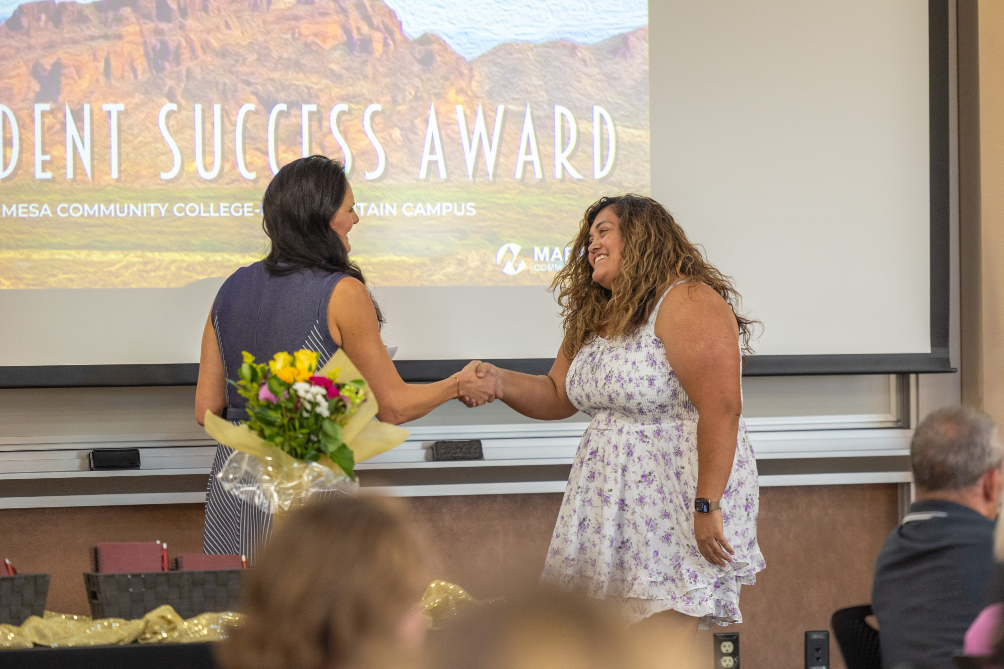 A student being presented with a Summit Award