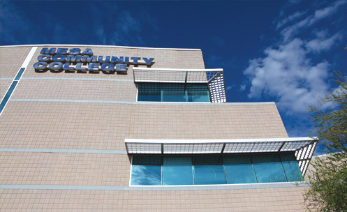 Looking up at the side of the library with an MCC sign at the top.