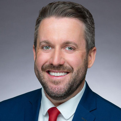 Photo of Ian Schwartz wearing a suit and tie