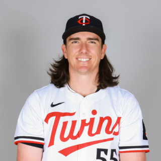 Kody wearing a white Minnesota Twins baseball jersey and a black hat.