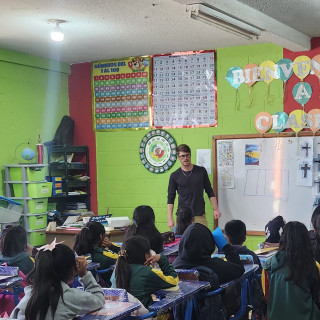 Riley Anderson teaching young students in Guatemala